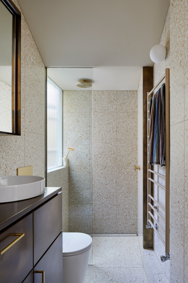 This is an example of a small contemporary bathroom in Melbourne with freestanding cabinets, brown cabinets, a walk-in shower, a one-piece toilet, beige tiles, stone tiles, beige walls, terrazzo flooring, a vessel sink, copper worktops, beige floors, an open shower, brown worktops, a single sink and a built in vanity unit.