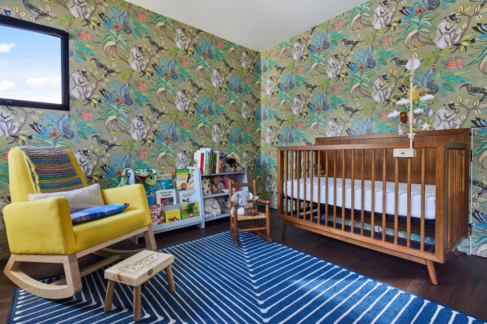Photo of a mid-sized mediterranean gender-neutral nursery in Los Angeles with green walls, dark hardwood floors, brown floor and wallpaper.