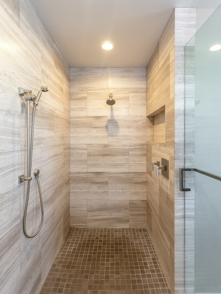 Photo of a large contemporary master bathroom in Los Angeles with a curbless shower, recessed-panel cabinets, dark wood cabinets, beige tile, travertine, beige walls, vinyl floors, an undermount sink, engineered quartz benchtops, brown floor and a hinged shower door.