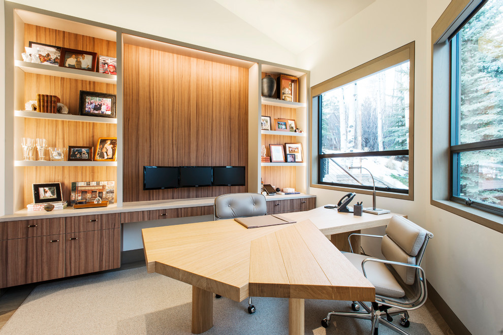 Contemporary study room in Denver with white walls and a freestanding desk.
