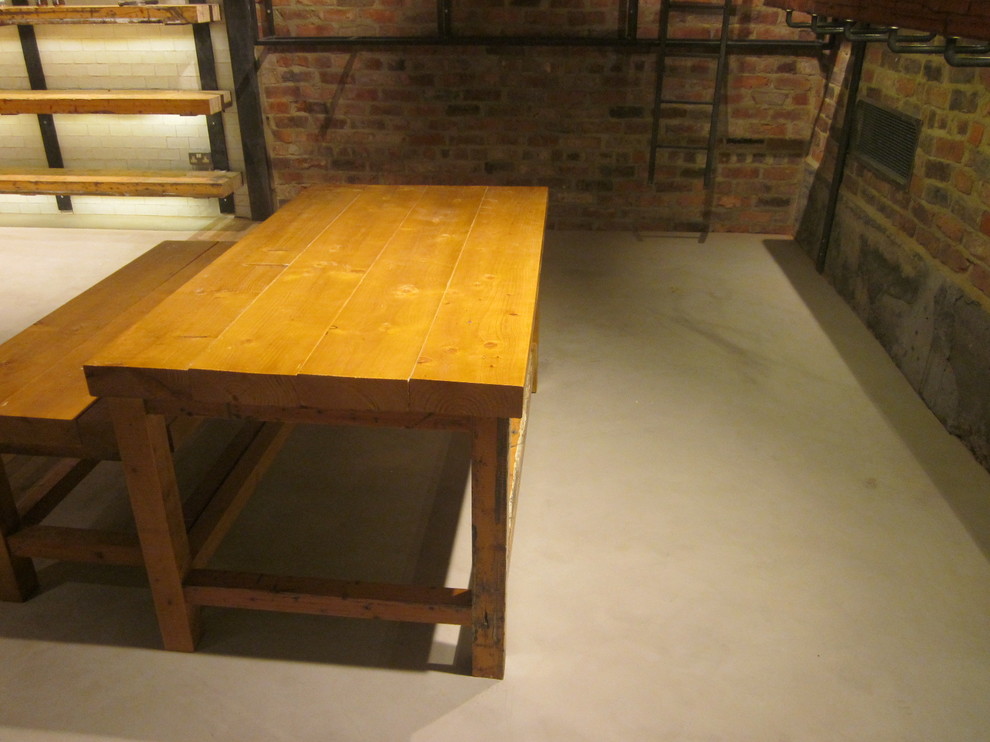 Design ideas for an industrial dining room in Other.