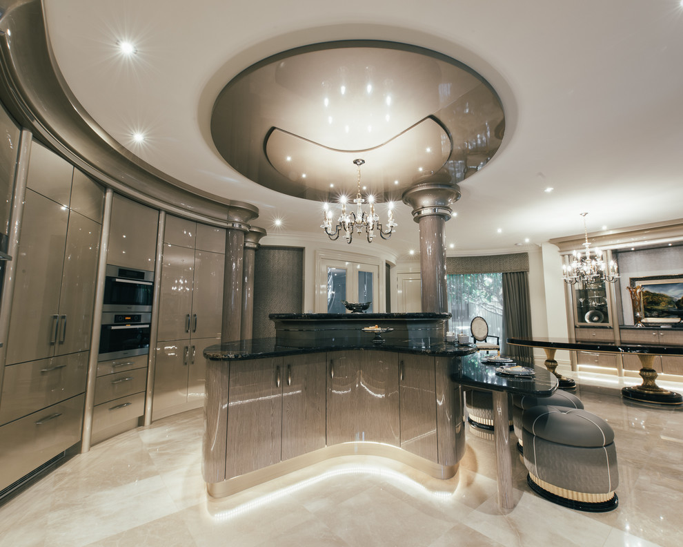 Inspiration for an expansive transitional u-shaped open plan kitchen in Perth with a double-bowl sink, beige cabinets, granite benchtops, black splashback, stone slab splashback, black appliances, marble floors and with island.