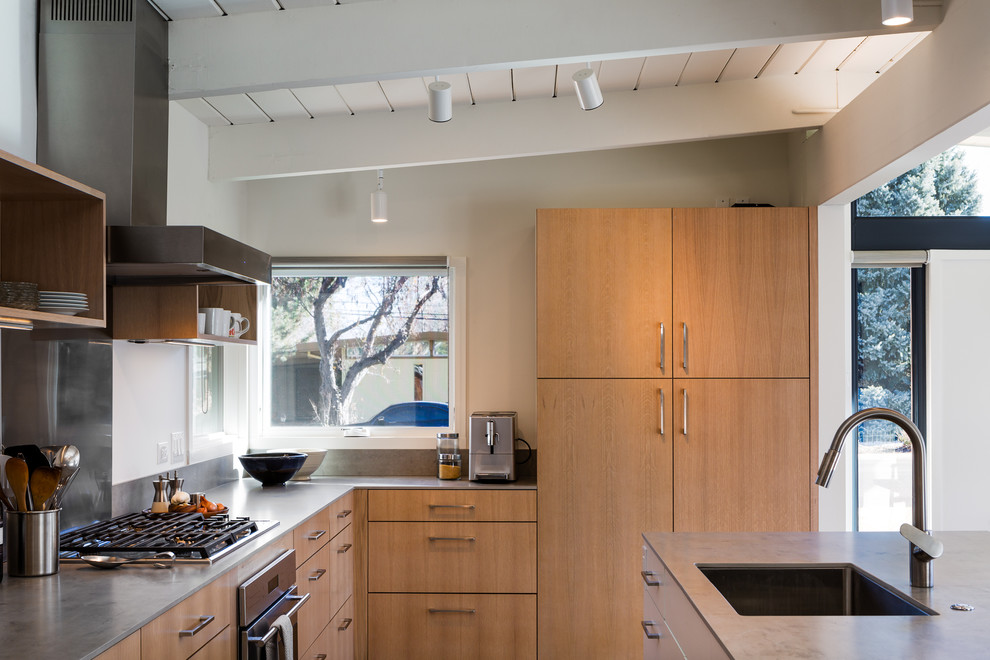 Midcentury eat-in kitchen in Denver with a single-bowl sink, flat-panel cabinets, light wood cabinets, tile benchtops, grey splashback, medium hardwood floors and with island.