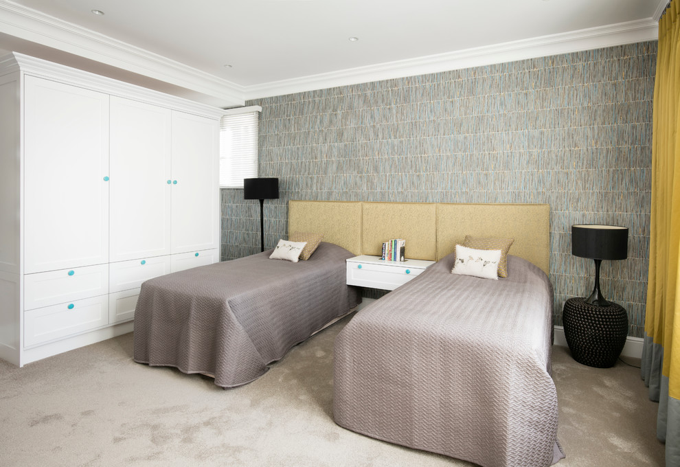 Transitional guest bedroom in London with multi-coloured walls and carpet.