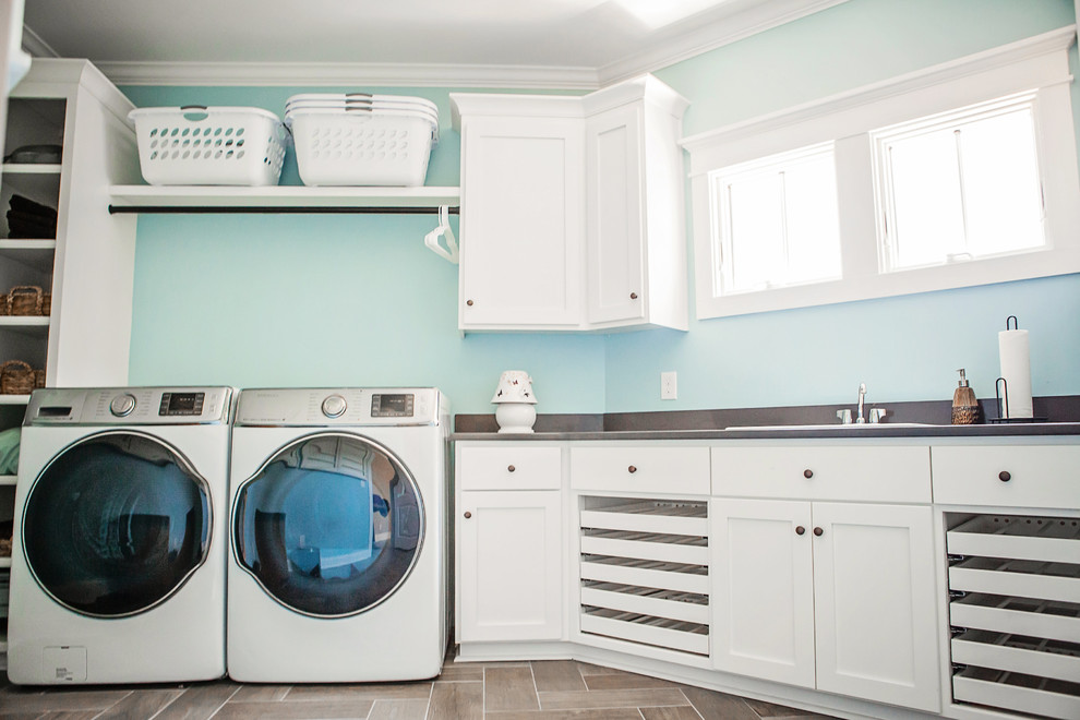 Design ideas for a transitional laundry room in Charlotte.