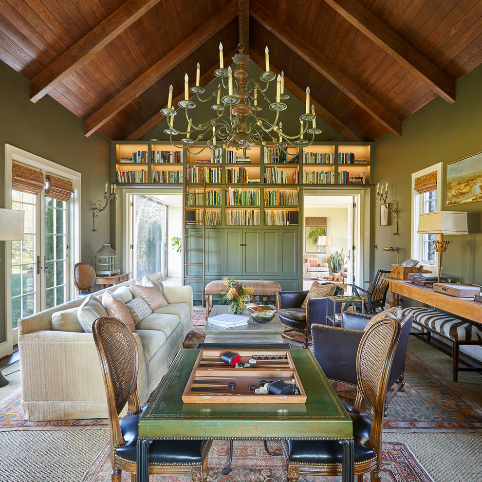Inspiration for a country enclosed family room in Tampa with a library, green walls and no fireplace.