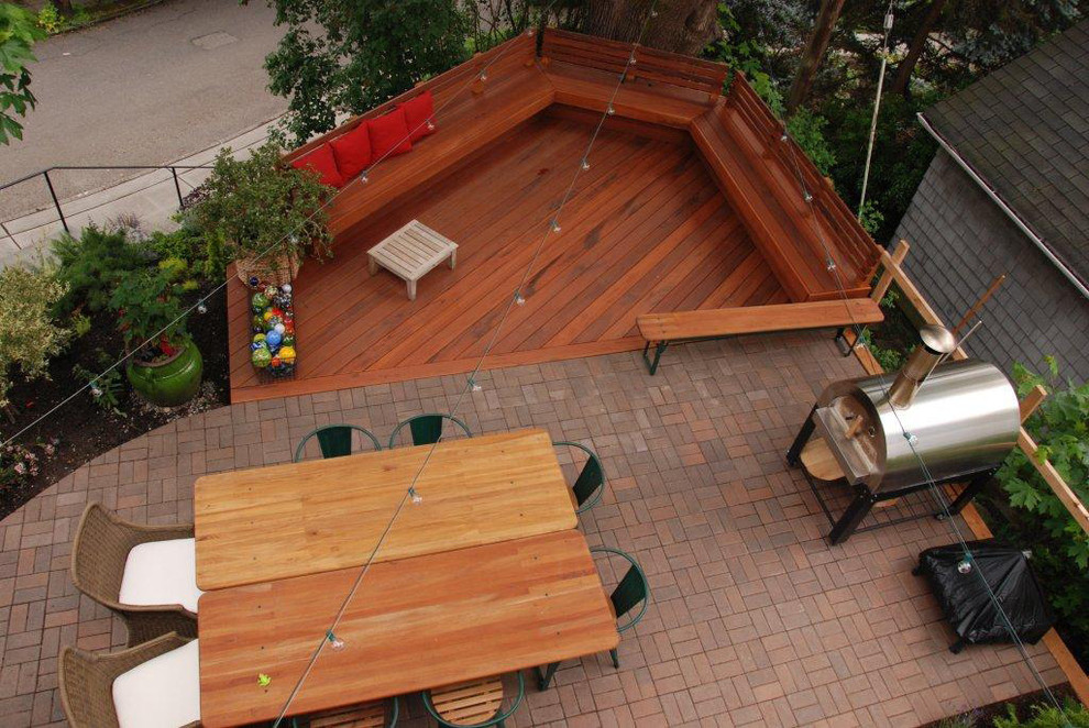 Photo of a small eclectic front yard patio in Seattle with decking.