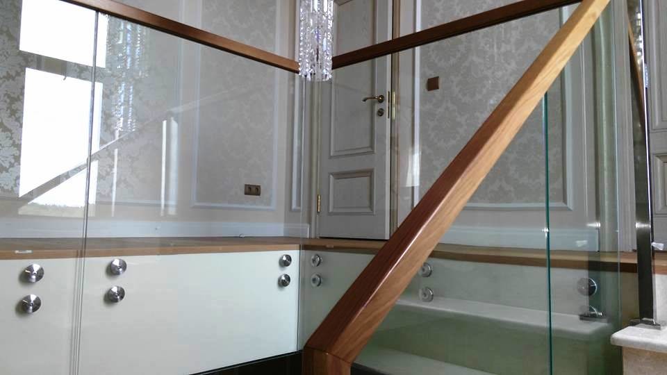 Design ideas for a contemporary staircase in Moscow with glass railing.