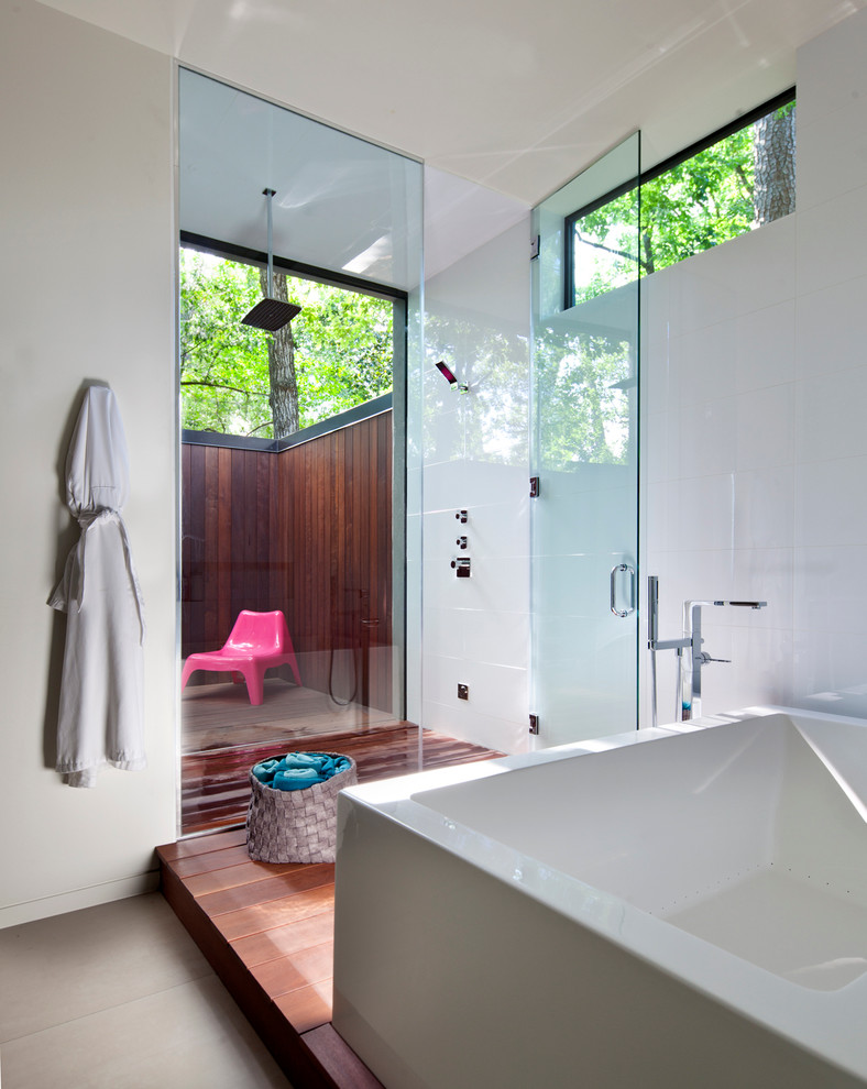 Contemporary bathroom in Houston with a freestanding tub, an open shower, white walls and an open shower.