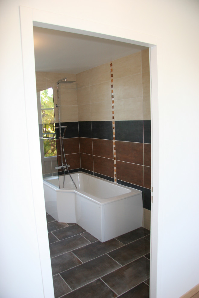 This is an example of a large tropical master bathroom in Other with a drop-in tub.