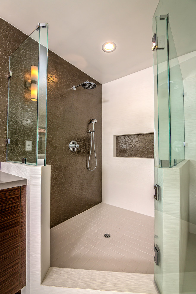 Inspiration for a large transitional master bathroom in San Francisco with flat-panel cabinets, dark wood cabinets, a freestanding tub, a two-piece toilet, beige tile, ceramic tile, beige walls, ceramic floors and an undermount sink.