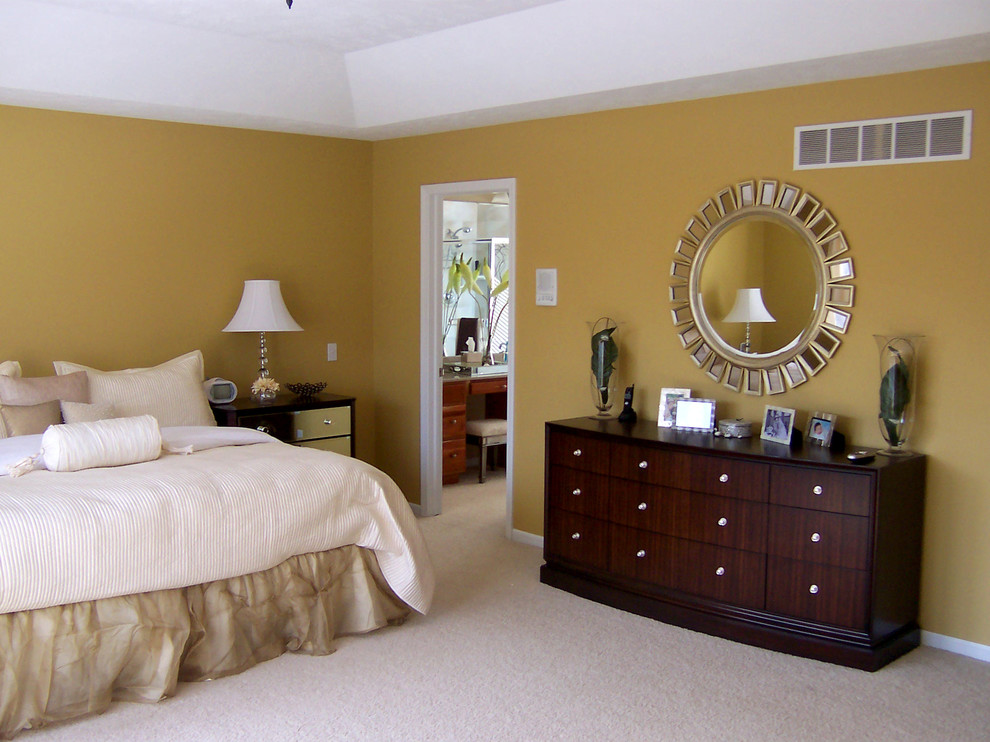 Inspiration for a large transitional master bedroom in Grand Rapids with yellow walls, carpet and no fireplace.