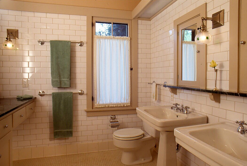 Mid-sized arts and crafts master bathroom in Los Angeles with recessed-panel cabinets, beige cabinets, an alcove tub, a shower/bathtub combo, a two-piece toilet, white tile, subway tile, white walls, a pedestal sink and marble benchtops.