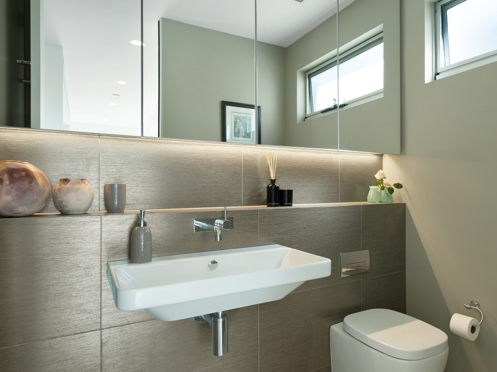 Inspiration for a small modern bathroom in Newcastle - Maitland with a one-piece toilet and a wall-mount sink.