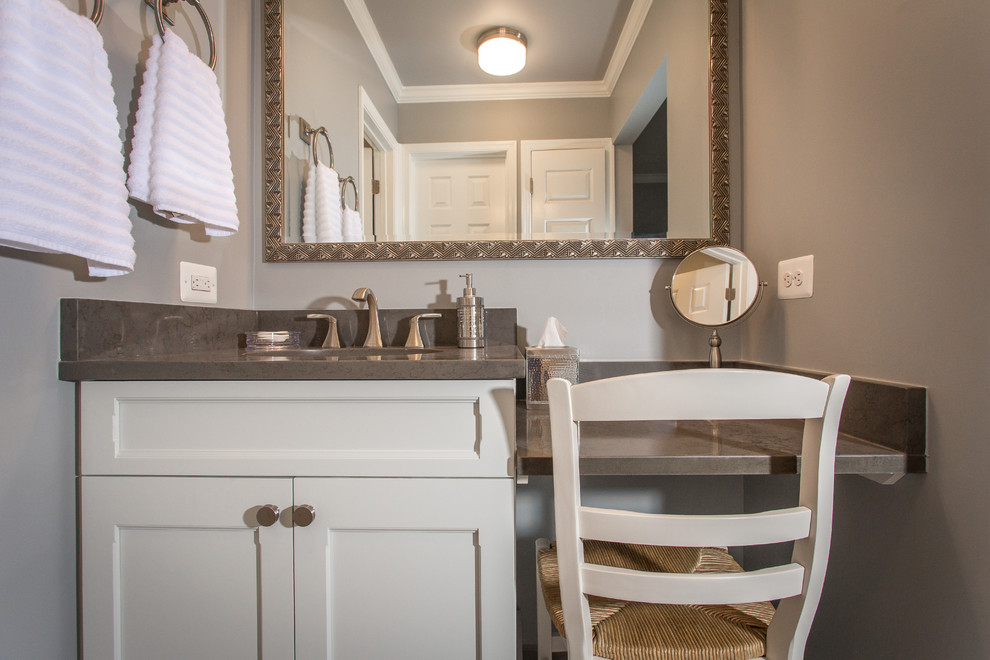 Mid-sized transitional gray tile and porcelain tile porcelain tile bathroom photo in DC Metro with an undermount sink, flat-panel cabinets, white cabinets, quartz countertops, a two-piece toilet and gray walls