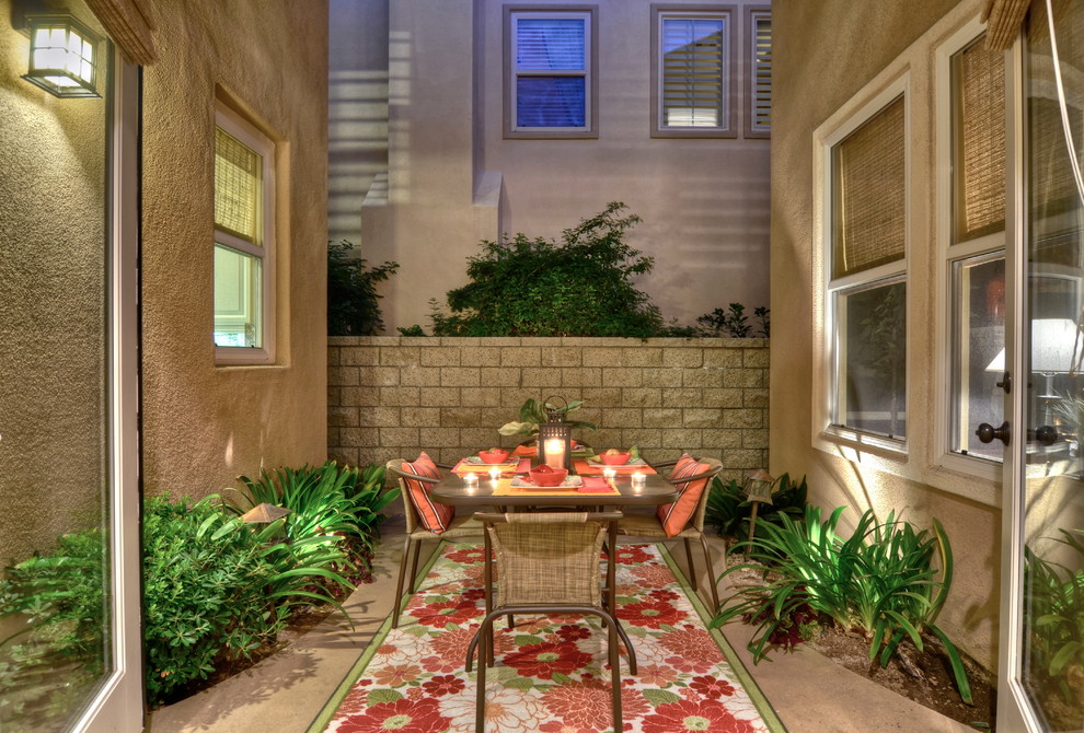 Traditional courtyard patio in Orange County with no cover.