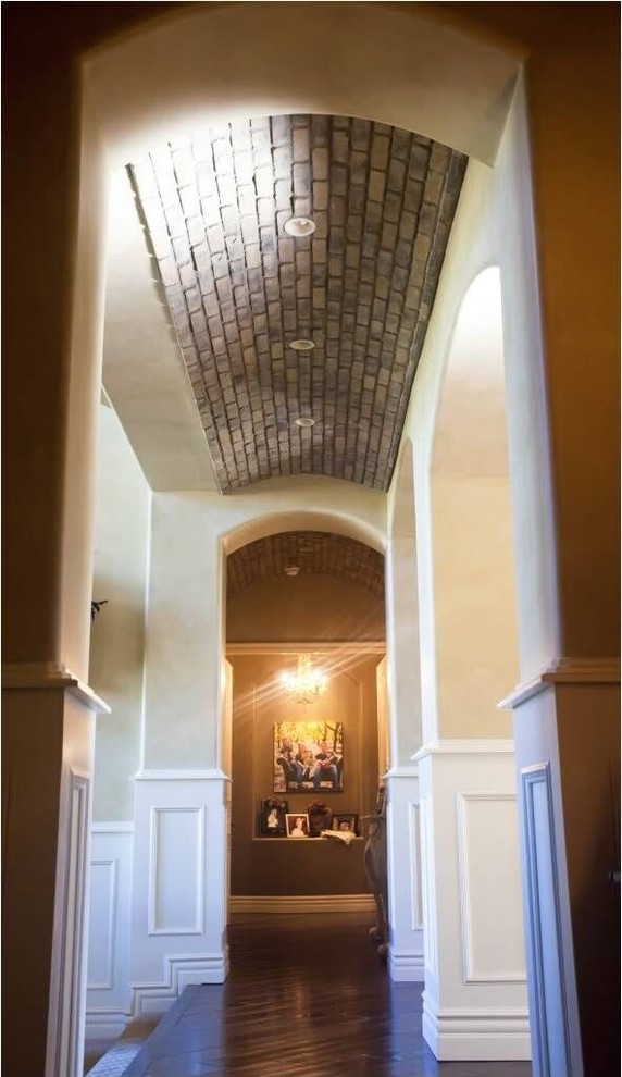 Mid-sized transitional dark wood floor and brown floor hallway photo in Phoenix with beige walls