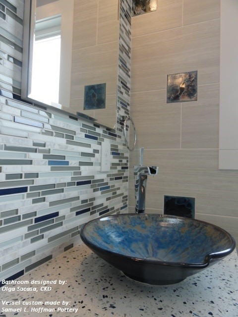 Mid-sized contemporary bathroom in Boston with a vessel sink, glass-front cabinets, dark wood cabinets, quartzite benchtops, a curbless shower, a one-piece toilet, brown tile, wood-look tile, blue walls and porcelain floors.