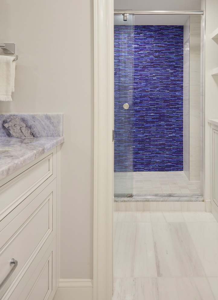 Design ideas for a small beach style master bathroom with recessed-panel cabinets, white cabinets, blue tile, glass tile, marble benchtops, blue benchtops, a double vanity and a built-in vanity.