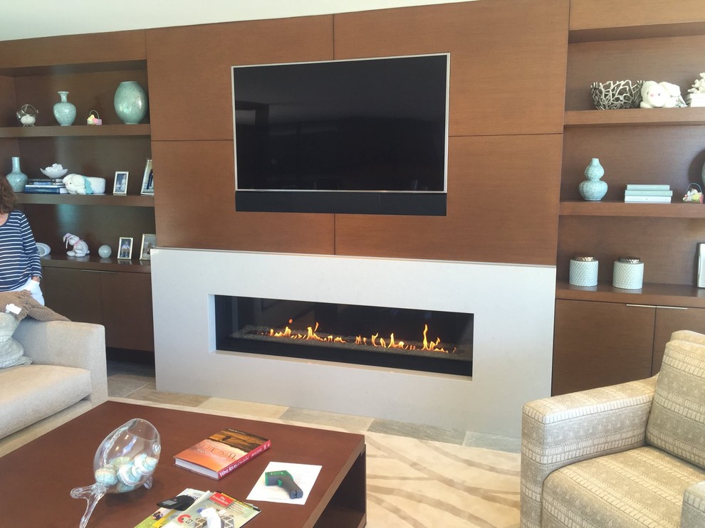 Photo of a mid-sized contemporary formal enclosed living room in San Diego with beige walls, a tile fireplace surround, a ribbon fireplace, porcelain floors, a wall-mounted tv and grey floor.