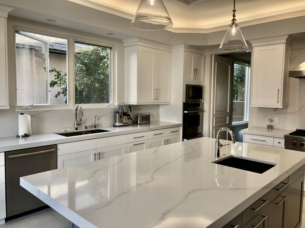 Inspiration for a large contemporary u-shaped eat-in kitchen in Los Angeles with a single-bowl sink, shaker cabinets, white cabinets, quartz benchtops, white splashback, engineered quartz splashback, stainless steel appliances, porcelain floors, with island, white floor, white benchtop and recessed.