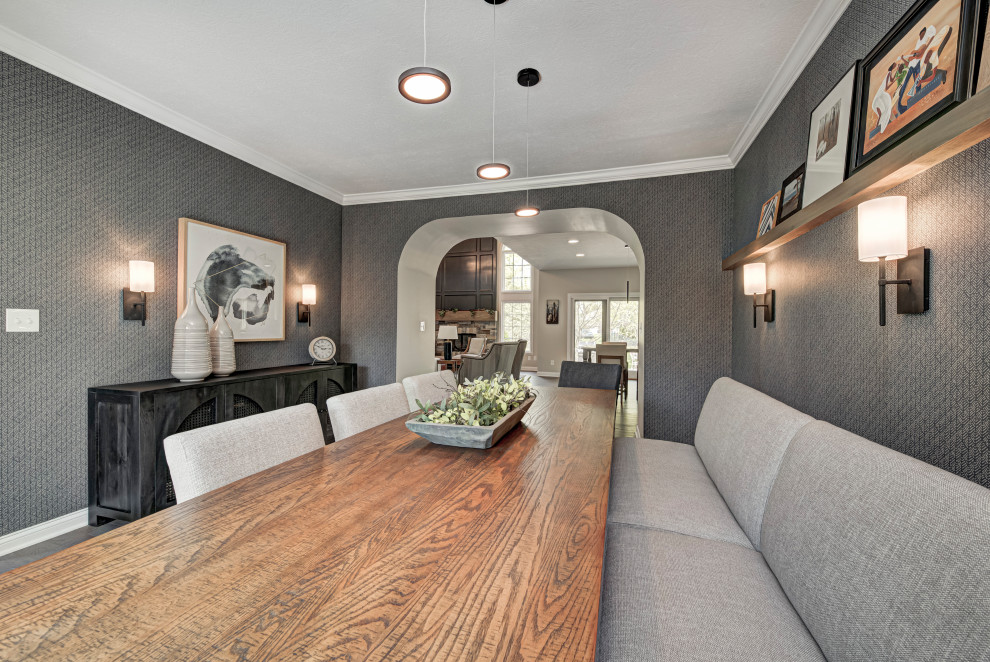 This is an example of a mid-sized contemporary separate dining room in Indianapolis with grey walls, dark hardwood floors, recessed, brown floor and wallpaper.