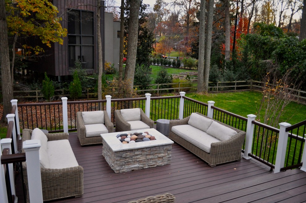 Design ideas for a large traditional backyard deck in DC Metro with an outdoor kitchen and a pergola.