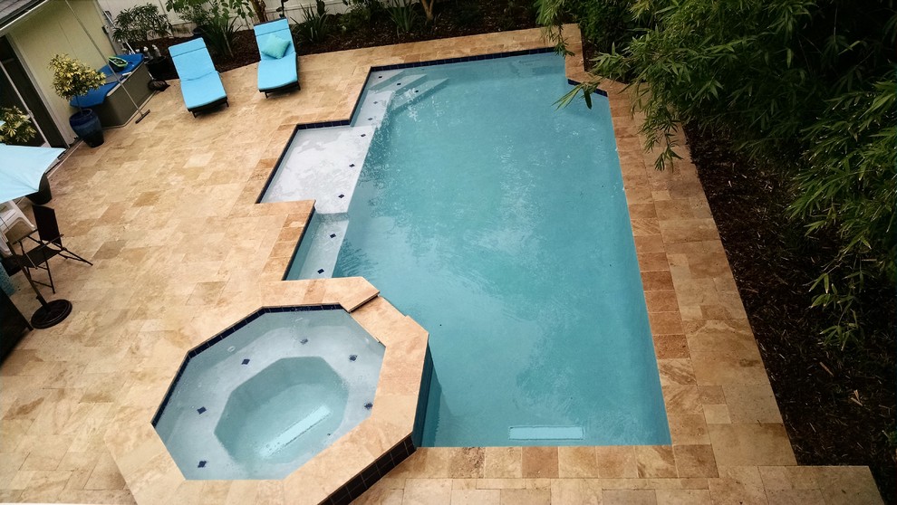 Design ideas for a mid-sized contemporary pool in Jacksonville.