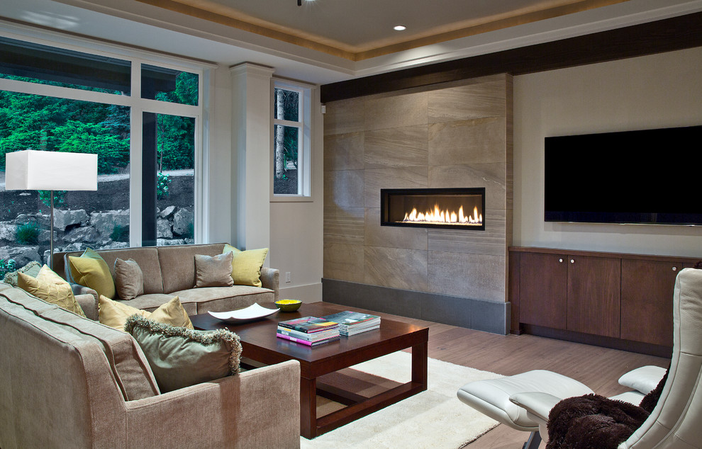 Inspiration for a mid-sized contemporary open concept living room in Seattle with grey walls, a ribbon fireplace, a stone fireplace surround, dark hardwood floors and a wall-mounted tv.