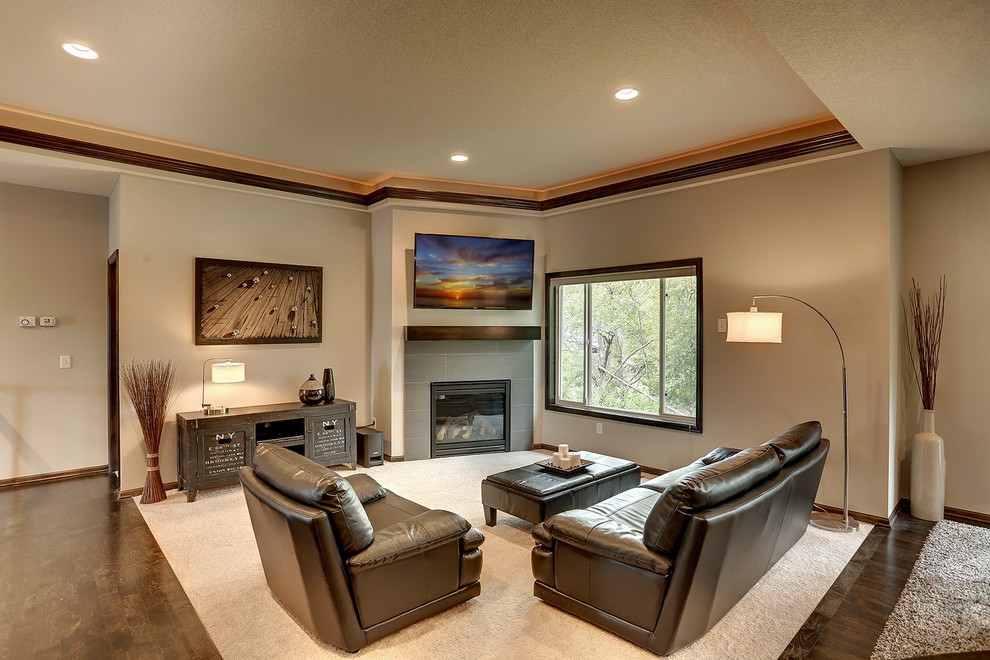 Inspiration for a mid-sized contemporary open concept living room in Minneapolis with grey walls, carpet, a corner fireplace, a tile fireplace surround and a wall-mounted tv.