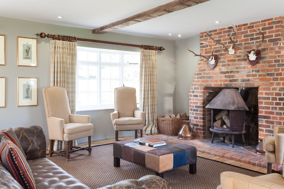 Eclectic family room in Gloucestershire with grey walls.