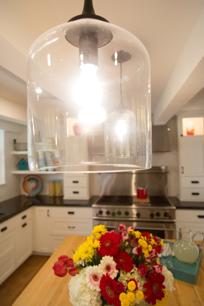 Inspiration for a mid-sized craftsman u-shaped ceramic tile and brown floor kitchen pantry remodel in Phoenix with a double-bowl sink, shaker cabinets, white cabinets, wood countertops, white backsplash, subway tile backsplash, stainless steel appliances and an island