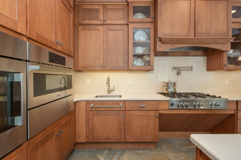 Huge transitional u-shaped open concept kitchen photo in Boston with an undermount sink, shaker cabinets, medium tone wood cabinets, quartz countertops, stone slab backsplash, stainless steel appliances and an island