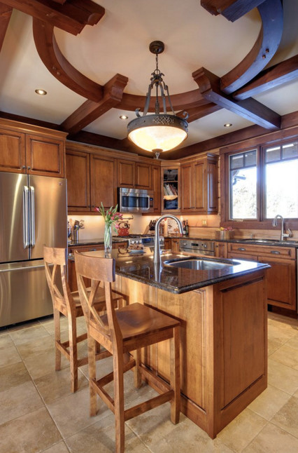 Open concept kitchen - large rustic galley dark wood floor open concept kitchen idea in Boston with an undermount sink, shaker cabinets, white cabinets, granite countertops, stainless steel appliances and an island