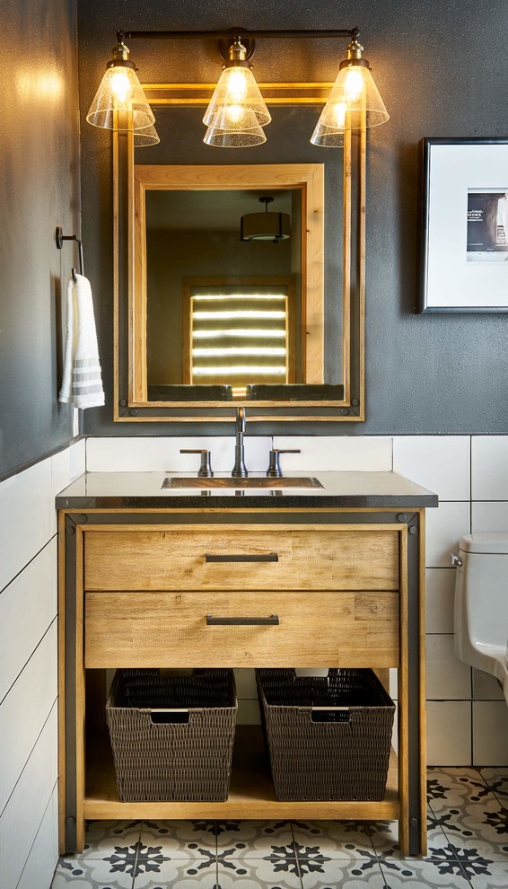 Inspiration for a transitional bathroom in Denver with medium wood cabinets, white tile, black walls, an undermount sink, multi-coloured floor, black benchtops and flat-panel cabinets.