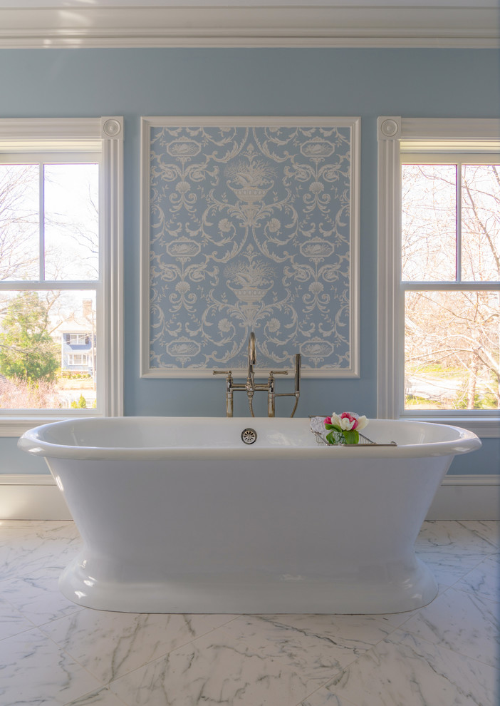 Design ideas for a mid-sized traditional master bathroom in Boston with a freestanding tub, blue walls, marble floors and white floor.
