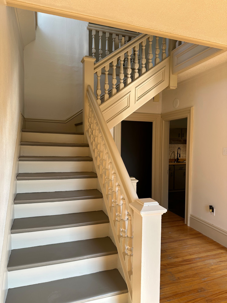 This is the impressive staircase that would make a good case for Colby and Emily ditching their bigger downstairs apartment and moving upstairs.  But I digress...