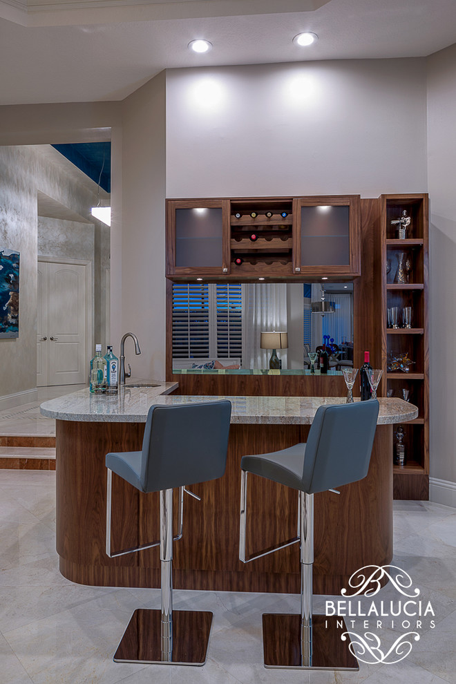 Photo of a small contemporary l-shaped seated home bar in Miami with an undermount sink, shaker cabinets, medium wood cabinets, granite benchtops and marble floors.