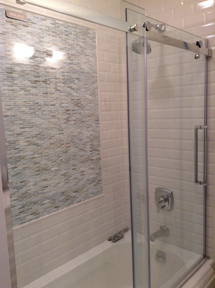 This is an example of a mid-sized transitional kids bathroom in New York with white tile and ceramic tile.