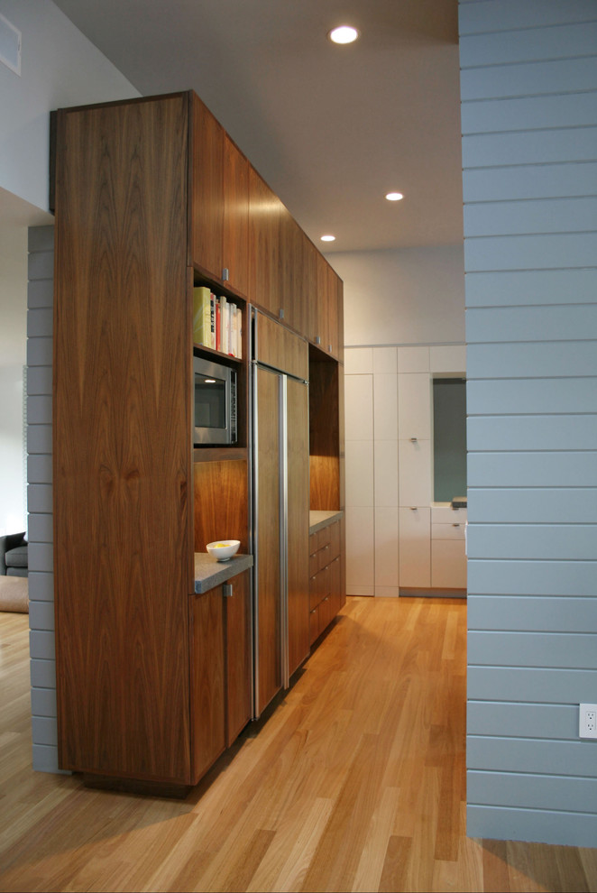 Photo of a transitional living room in San Francisco with light hardwood floors and white walls.