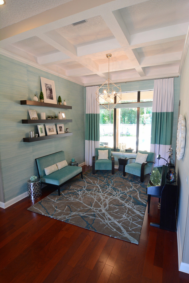 Inspiration for a mid-sized contemporary enclosed living room in Jacksonville with blue walls, medium hardwood floors, no fireplace and no tv.