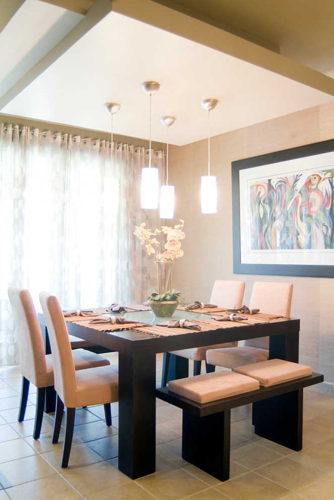 This is an example of a contemporary dining room in Other with beige walls and beige floor.