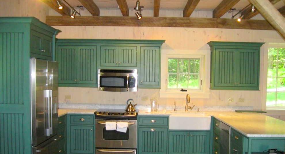 Design ideas for a mid-sized country u-shaped eat-in kitchen in Bridgeport with a farmhouse sink, louvered cabinets, green cabinets, marble benchtops, white splashback, stainless steel appliances and a peninsula.