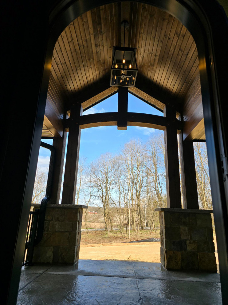 Inspiration for a large transitional brown floor single front door remodel with beige walls and a dark wood front door