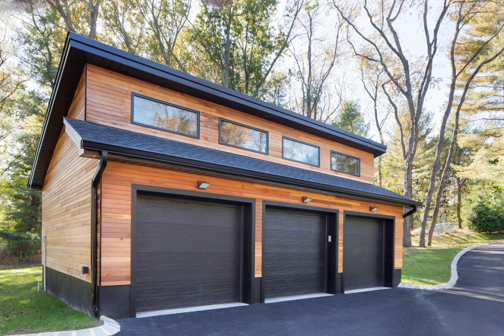 This is an example of a contemporary detached three-car garage in New York.