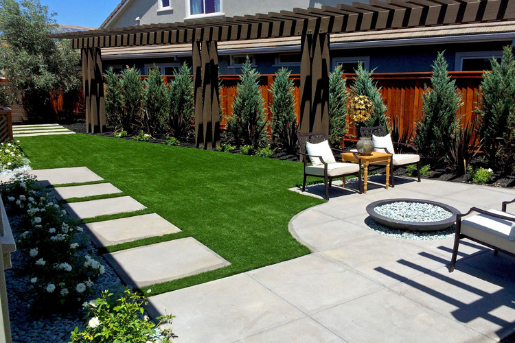 Inspiration for a large contemporary backyard patio in Phoenix with a fire feature, concrete slab and no cover.