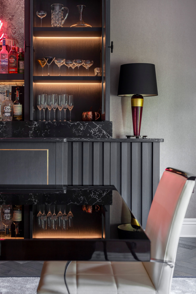 This is an example of a contemporary home bar in Surrey.