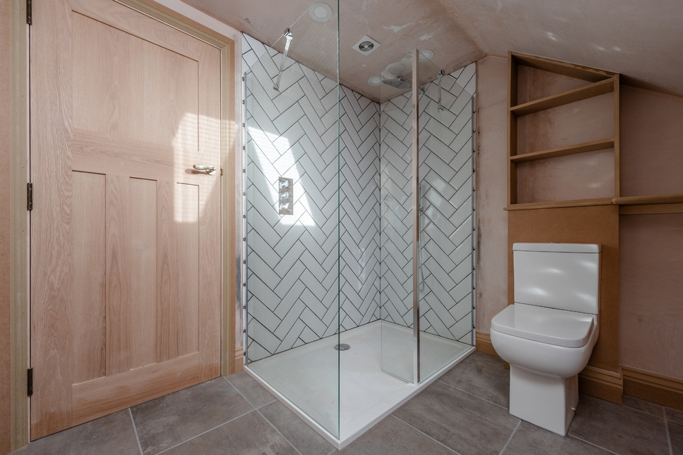 Inspiration for a small traditional master bathroom in Other with open cabinets, white cabinets, an open shower, a two-piece toilet, white tile, ceramic tile, grey walls, ceramic floors, a pedestal sink, grey floor and an open shower.