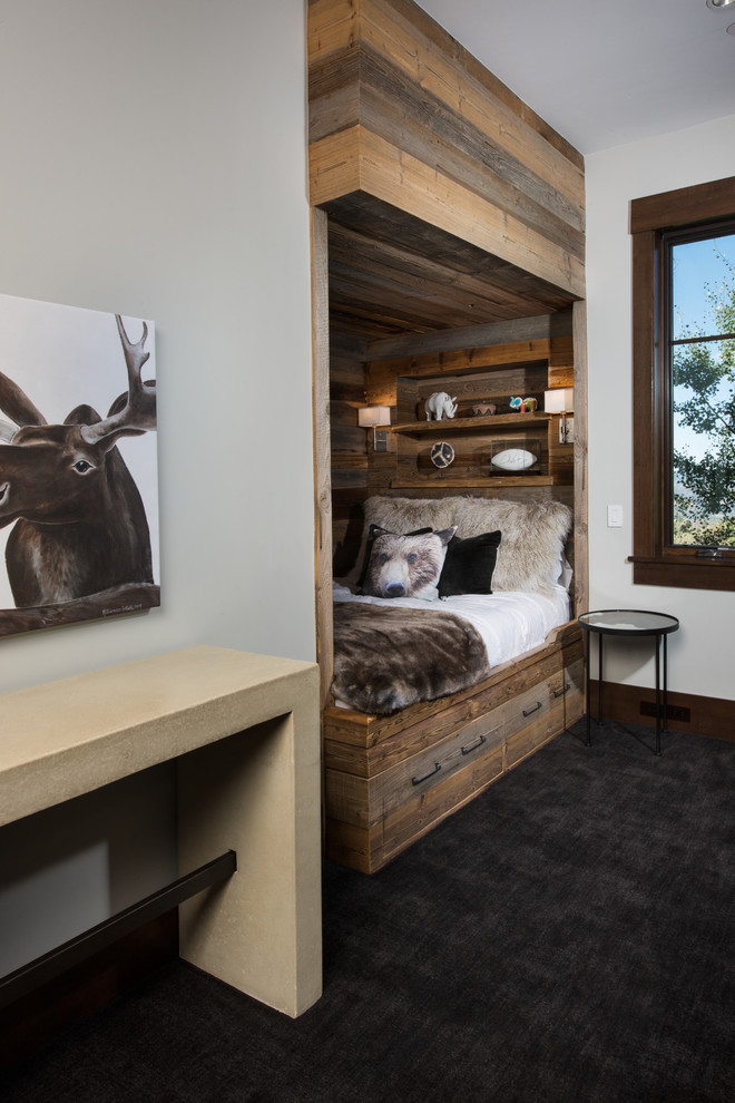 Design ideas for a mid-sized country guest bedroom in Denver with beige walls and carpet.