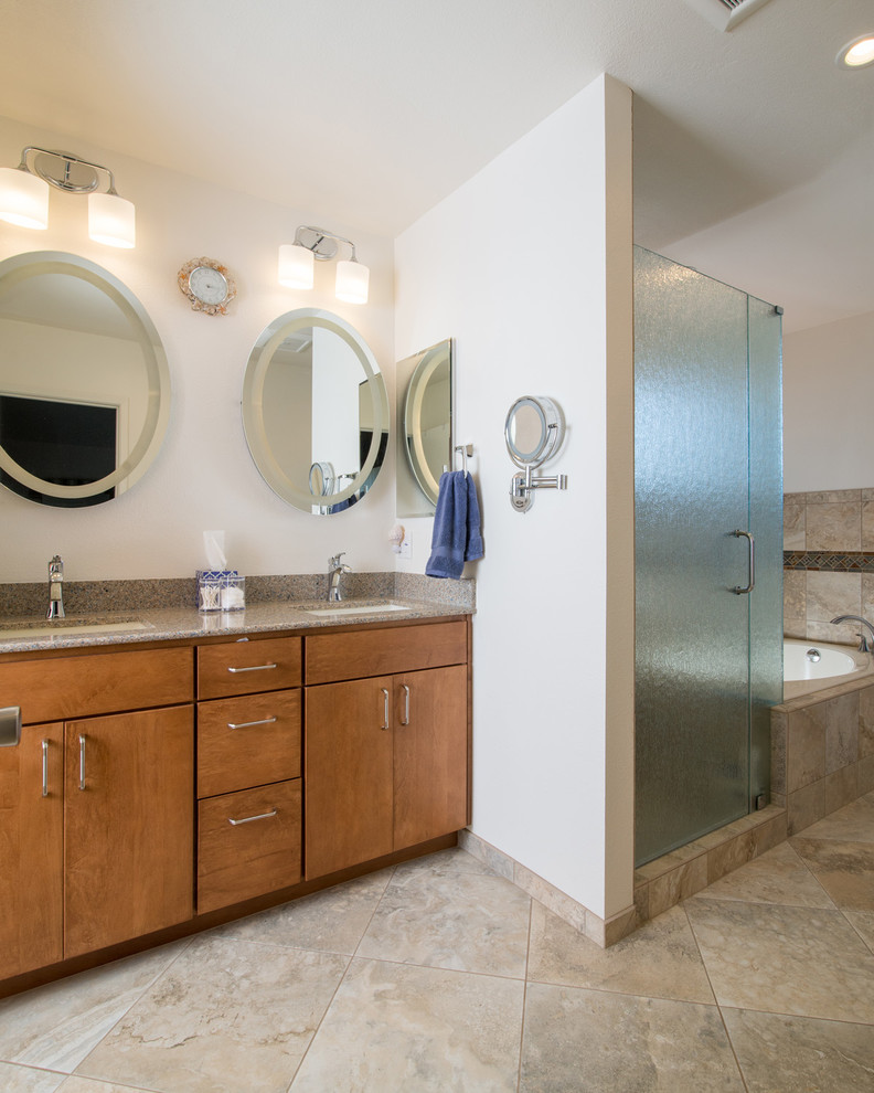 Mid-sized traditional master bathroom in San Diego with an undermount sink, raised-panel cabinets, light wood cabinets, granite benchtops, a corner tub, an open shower, a one-piece toilet, beige tile, ceramic tile, blue walls and ceramic floors.